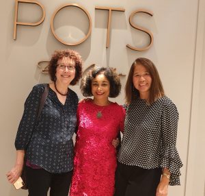 Three BIWC members pose in front of the restaurant POTS