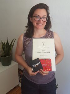 Megan with her award certificate and gift vouchers
